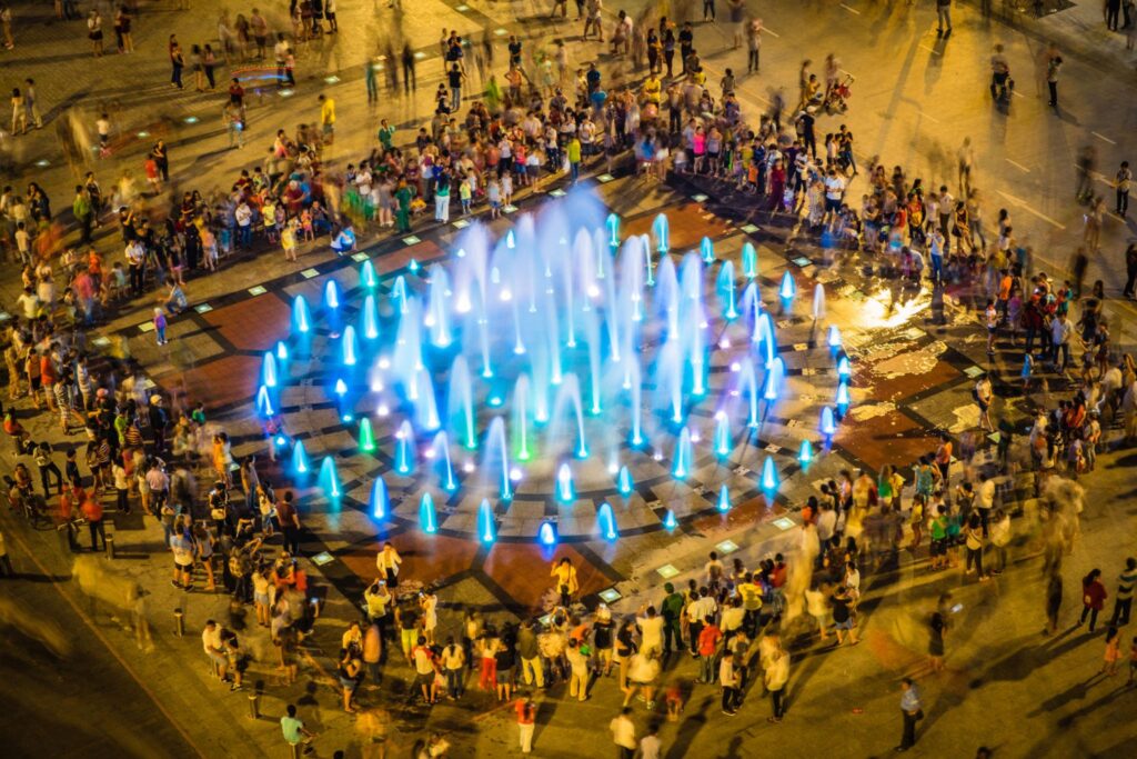 People are surrounded by music performances at Nguyen Hue